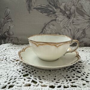 Elegant Cream and Gold Teacup and Saucer Set